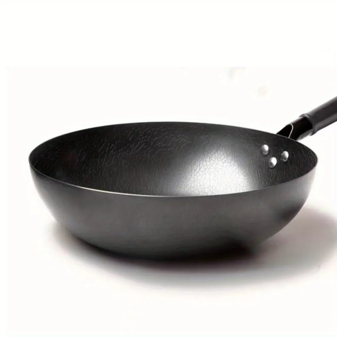 carbon steel wok on electric stove