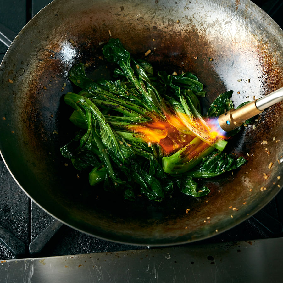 Delicious Asian meal freshly cooked in a well-maintained wok
