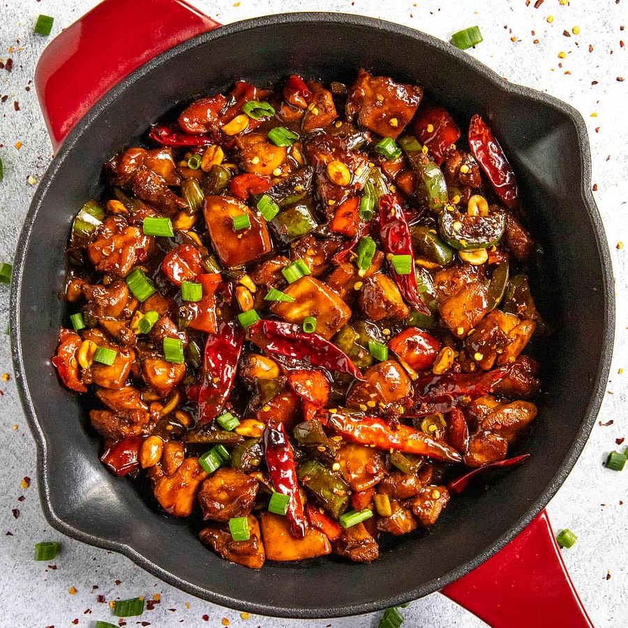 Delicious stir-fried Kung Pao Chicken served in a bowl